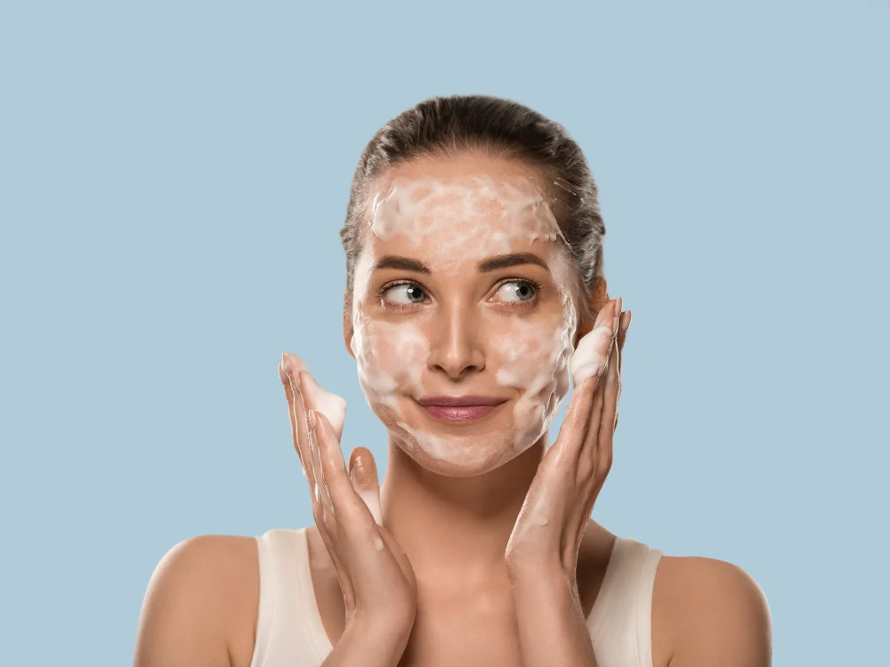 Woman applying gentle facial cleanser for face white karne ka tarika brightening routine